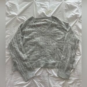 Francesca’s light grey sweater